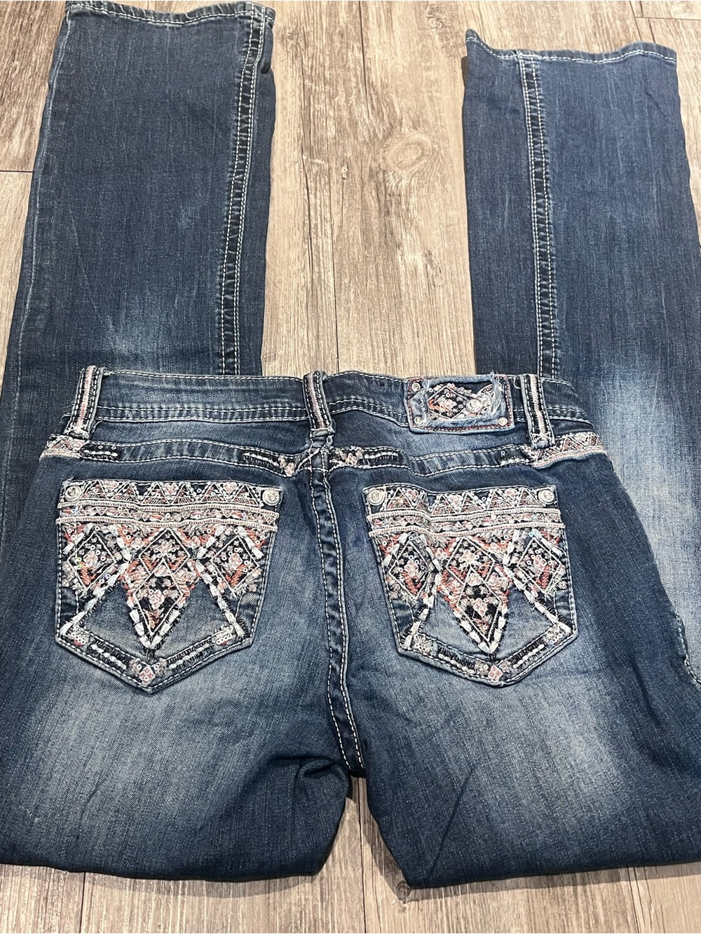 Grace in LA blue bootcut jeans with orange and white embroidered pockets